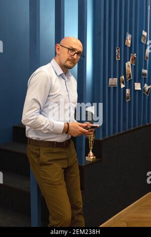 Young millennial businessman using mobile phone. Work from home Stock Photo
