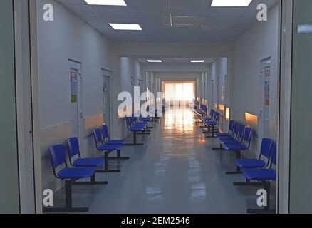 The empty corridor of a hospital in the morning and the sun at the windows Stock Photo