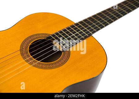 Acoustic guitar isolated on white, close up. Classical Guitar Standing On White Background. Selective focus Stock Photo