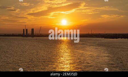 Kingston upon Hull, England, UK - May 22, 2019: The setting sun over the harbour, seen from the River Humber Stock Photo
