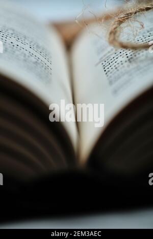 Photo of pages of book and thread. Close up Stock Photo