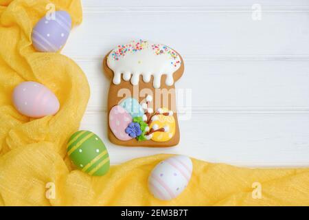 Easter with colorful eggs and traditional cakes over white wooden table. Top view with copy space Stock Photo