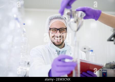 Close up of two scientists checking the quality of water in the laboratory. Stock Photo