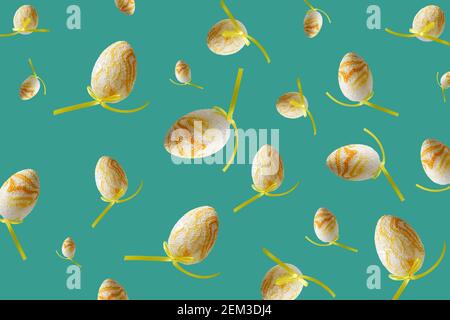 Spring pattern with flying yellow eggs on turquoise background. Zero gravity easter concept. Stock Photo