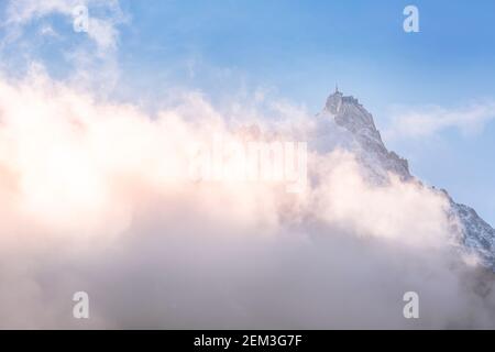 Aiguille du Midi peak between clouds, mountain in the Mont Blanc massif ...
