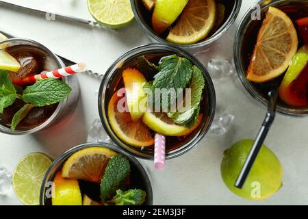 Glasses of Cuba Libre on white textured table, top view Stock Photo