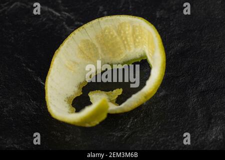 Lemon peel isolated on a black background. Stock Photo