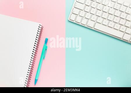 Workspace with notebook, pen and keyboard Stock Photo