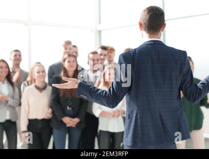 rear view. the young leader explaining something to his team Stock Photo