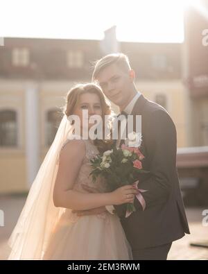 bride and groom look at each other tenderly. Stock Photo