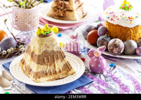 Festive Easter table with colored eggs, Orthodox bread and cottage cheese Easter. Stock Photo