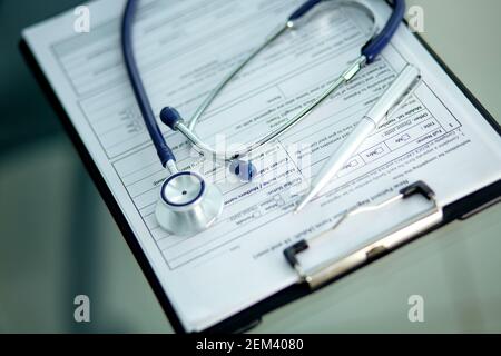 close-up. image of a stethoscope, pen and clipboard on the doctor's desktop. Stock Photo