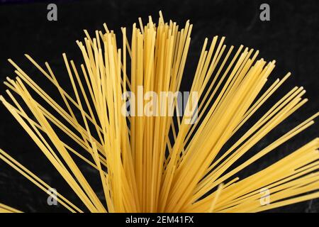 Raw dry spaghetti on a black background Stock Photo