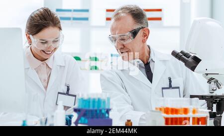 close up. scientists work in the laboratory for blood research. Stock Photo