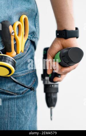 Electric tool for fixing and professional builder or handyman on work Stock Photo
