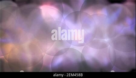 A set of realistic water or soap bubbles with a rainbow reflection.Blurred background Stock Vector