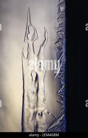 Detail of ice crystals on frozen window. Stock Photo