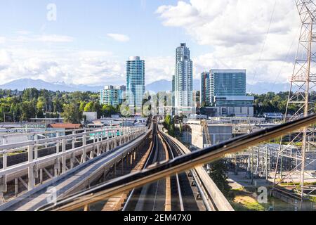 View from the TransLink SkyTrain on the Canada Line crossing the Fraser River towards Marine Drive, Vancouver, British Columbia, Canada Stock Photo