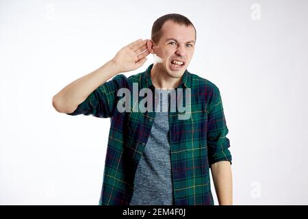 Man does not hear well, makes gestures with his hands Stock Photo