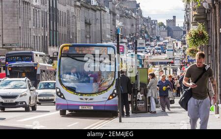 Single decker First bus at a stop in Union Street in the city centre of Aberdeen, Scotland Stock Photo