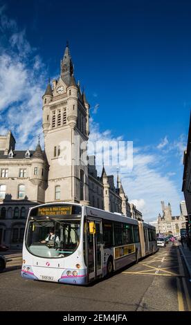 Single decker First bus passes the Townhouse in Union Street in the city centre of Aberdeen, Scotland Stock Photo