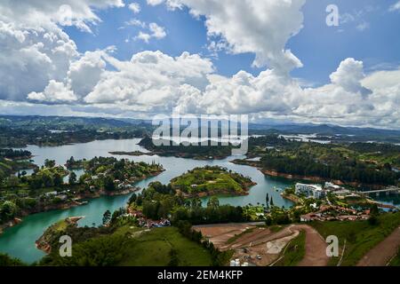 View of Guatape from the top of El Penon onto the artificial lake with its turquoise water and lagoons Stock Photo