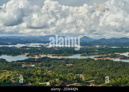 View of Guatape from the top of El Penon onto the artificial lake with its turquoise water and lagoons Stock Photo