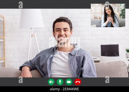Man Having Online Video Call With Asian Woman Stock Photo