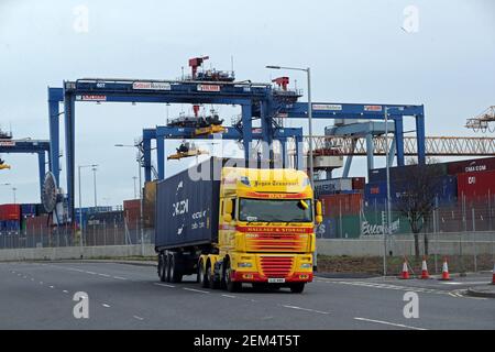 A freight lorry leaving Belfast Port, the post-Brexit Northern Ireland Protocol has left freight companies struggling for return loads after after extra paperwork has been required with some hauliers based in Northern Ireland seeing revenues fall by up to 30% in January, an industry representative has said. Picture date: Wednesday February 24, 2021. Stock Photo