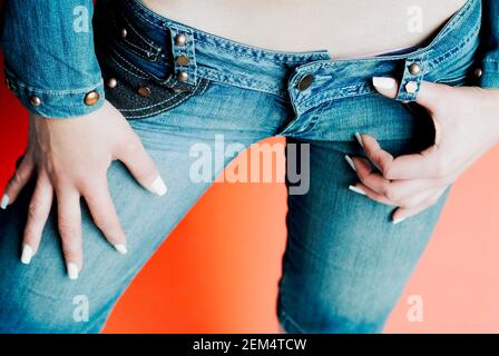 Mid section view of a woman wearing jeans Stock Photo