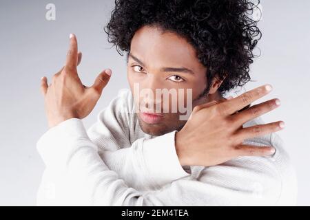 Portrait of a young man gesturing Stock Photo