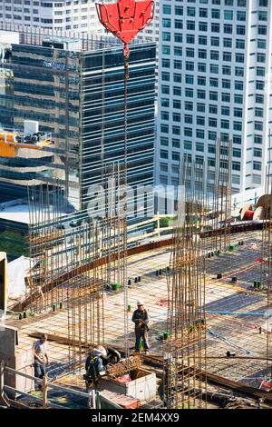 Construction of the building. Workers unrecognizable make metal ...