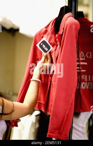 hand Checking price tag on cloth Stock Photo - Alamy