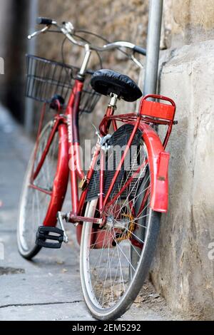 Bicycle leaning against a wall Stock Photo