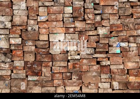 The stack of the old wooden sleepers for making a rail track. Industrial background pattern. Stock Photo