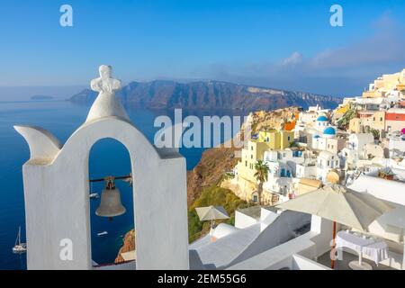 Greece. A sunny day on Santorini. Church bell and hotel terraces in Oia Stock Photo