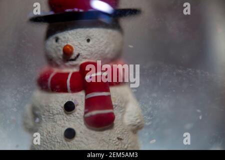 A Snowman inside a snowglobe. Stock Photo