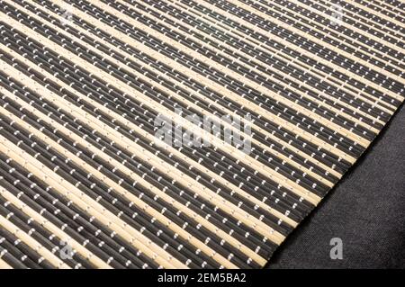 brown bamboo Mat - stand food, close-up, macro, black background Stock Photo