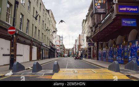 London, UK. 24th Feb, 2021. Closed bars and restaurants on the deserted Old Compton Street in Soho, London.England will begin easing the lockdown restrictions in several stages from March, with shops, bars and restaurants expect to reopen in April. Credit: Vuk Valcic/SOPA Images/ZUMA Wire/Alamy Live News