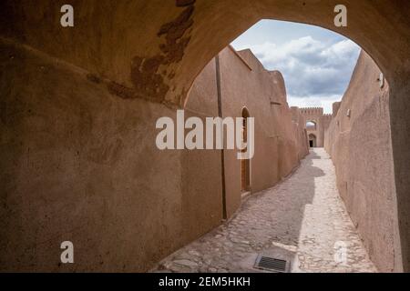 Narrow streets of ancient persian city built from mud bricks. Rayen Citadel, Mahan, Iran, Persia. Stock Photo