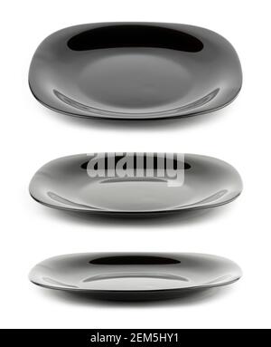Set of empty black plates isolated on white background with different angle of view Stock Photo