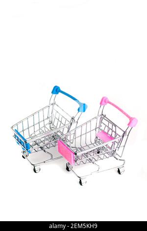 Two shopping basket blue and pink on white background with copy space Stock Photo