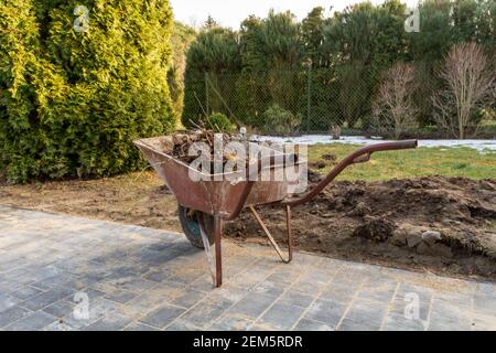 Spring cleaning work in the garden. Stock Photo