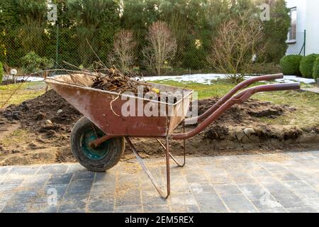 Spring cleaning work in the garden. Stock Photo