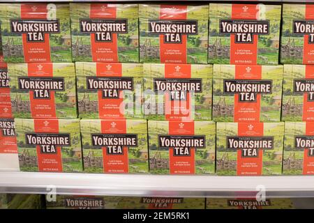 large amount of Yorkshire tea bags boxes neatly layout on shelves for sale in supermarket, UK Stock Photo