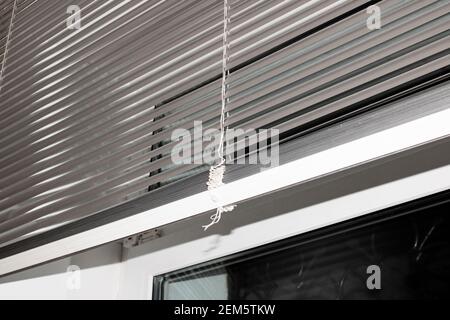 Metal blinds on the window in the office close up Stock Photo