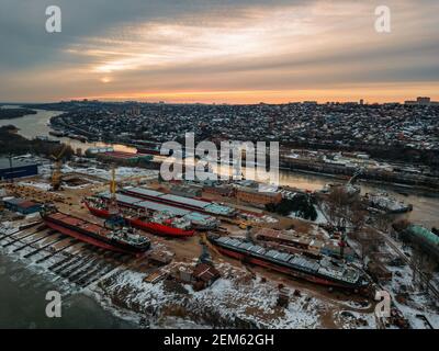 Ships and barges in dry dock for repair, aerial view. Stock Photo