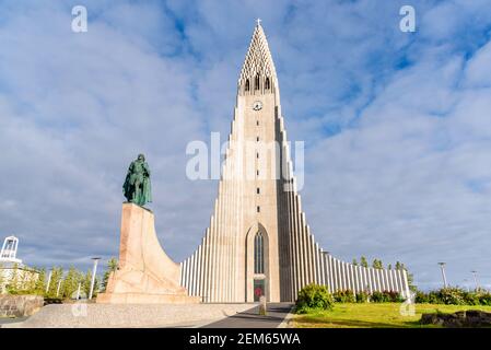 View of Hallgrimskirkja church with statue of Leif Eriksson in foregrond in central Reykjavik, Iceland, on a sunny summer evening Stock Photo