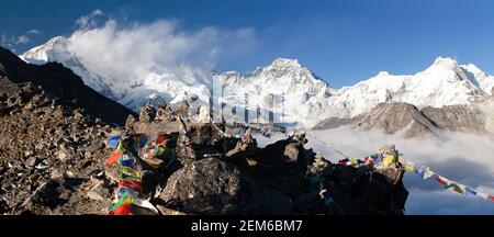 Panoramic view of mount Cho Oyu and mount Gyachung Kang with prayer flags from Gokyo Ri, way to Cho Oyu base camp, Gokyo valley, Sagarmatha national p Stock Photo