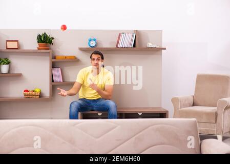 Young student boring at home during pandemic Stock Photo